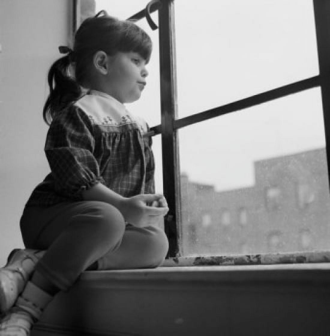 Little girl looking out window Canvas Art - (24 x 36)