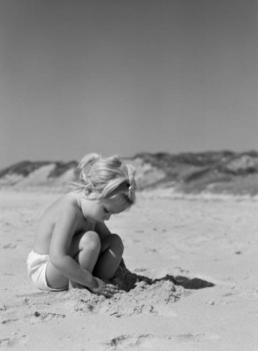Little girl playing on beach Canvas Art - (18 x 24)