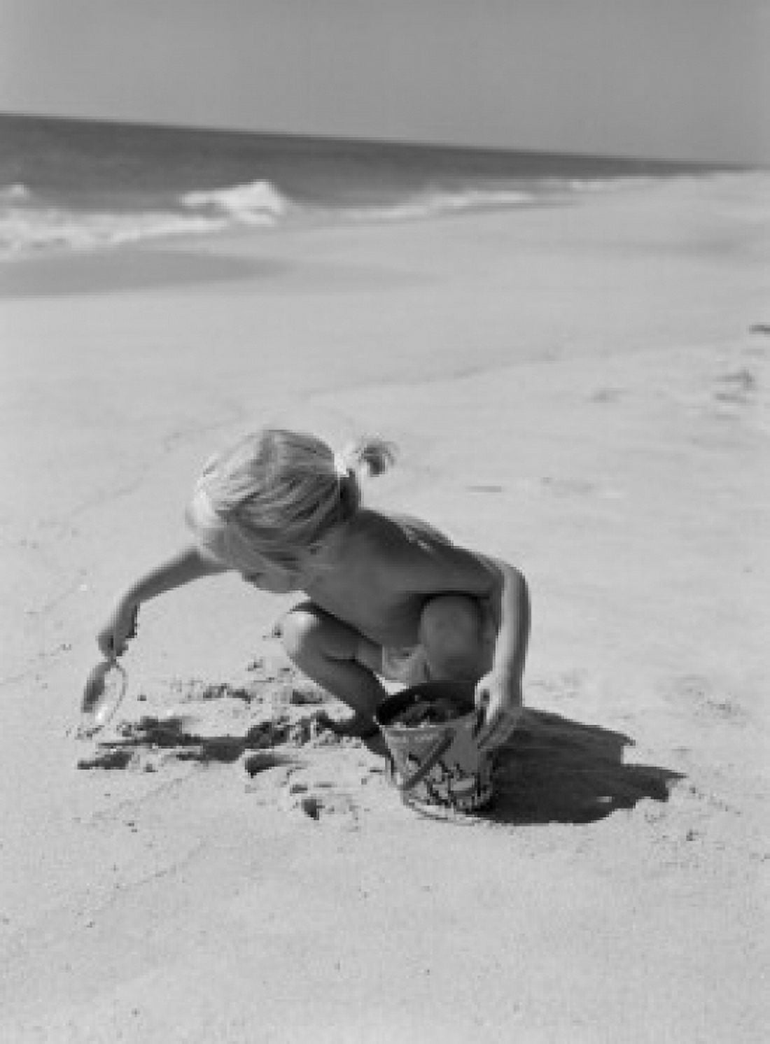 Little girl playing on beach Canvas Art - (24 x 36)