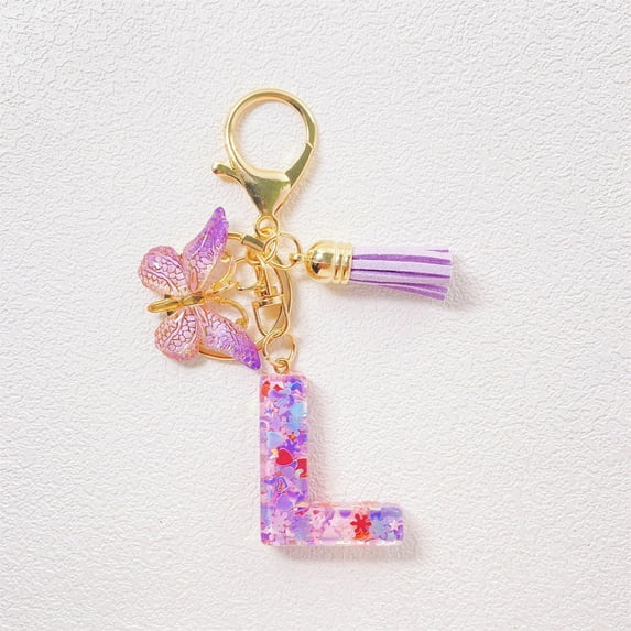 Llavero con letra inicial para mujer, con borla morada, bonito llavero para coche, para cartera, mochila y bolso.