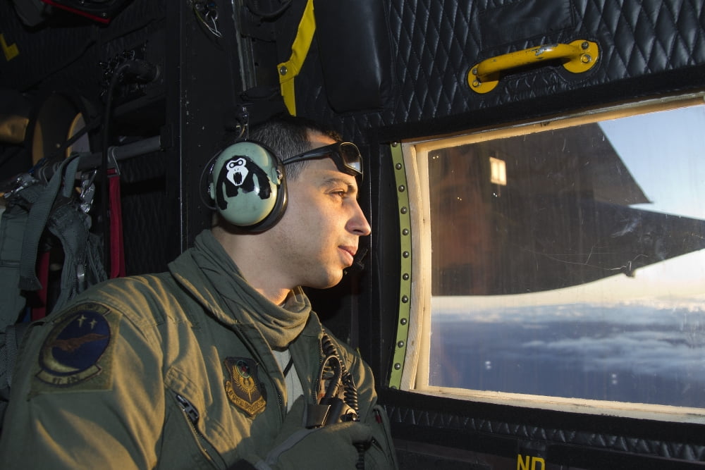 Loadmaster at work as lookout in a MC-130P Combat Shadow Canvas Art - Gert KromhoutStocktrek Images (18 x 12)