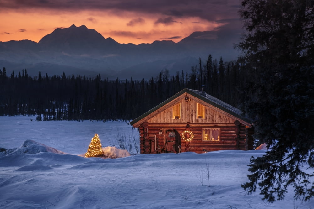Log cabin with Christmas tree and decorations Mt Mckinley and Alaska Range in the background Southcentral Alaska Canvas Art - Jeff Schultz Design Pics (38 x 24)
