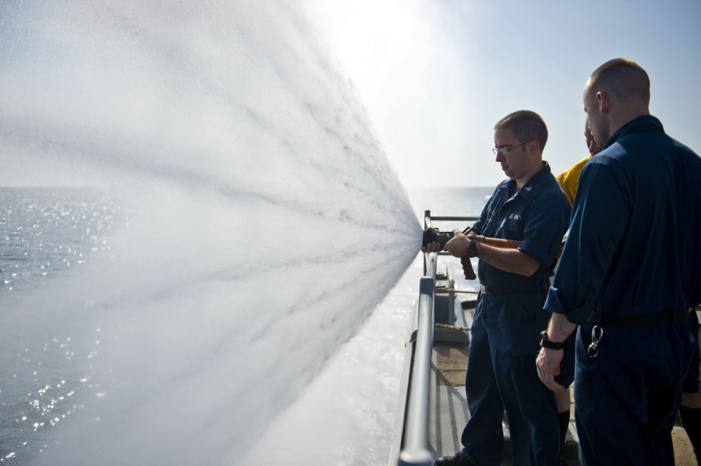 Logistics Specialist practices fire hose handling Canvas Art - Stocktrek Images (35 x 23)