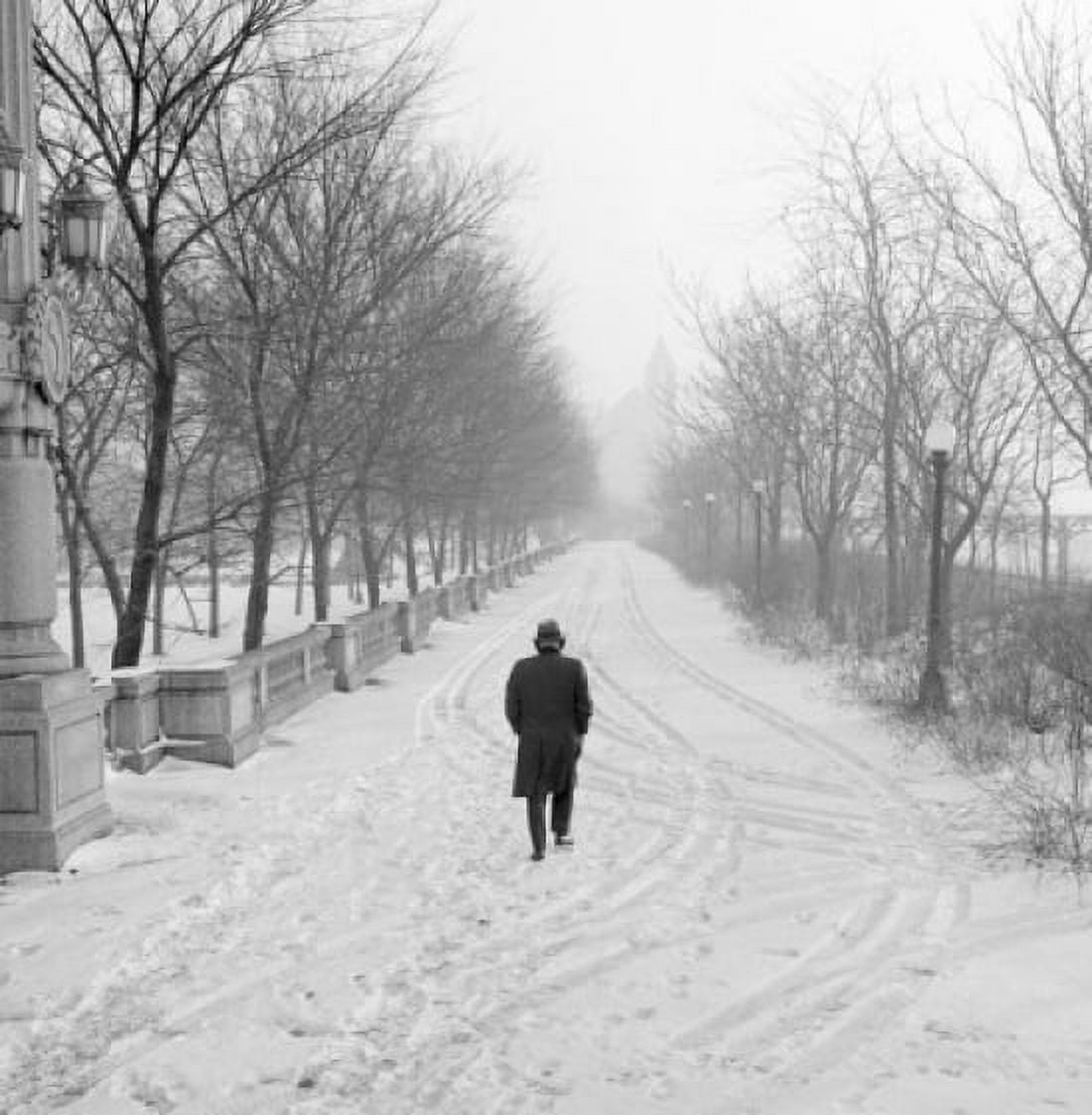 Lonely man walking in winter park Canvas Art - (24 x 36)