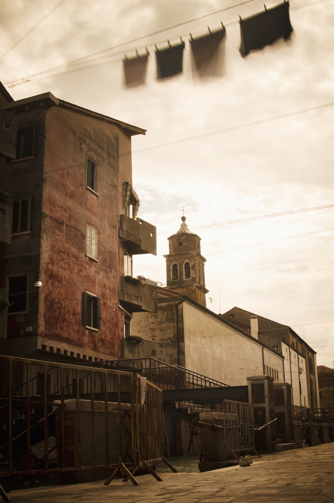 Long exposure of clothing drying on a clothesline moving in the breeze in the Castello district Venice Italy Canvas Art - Rick Senley Design Pics (24 x 38)