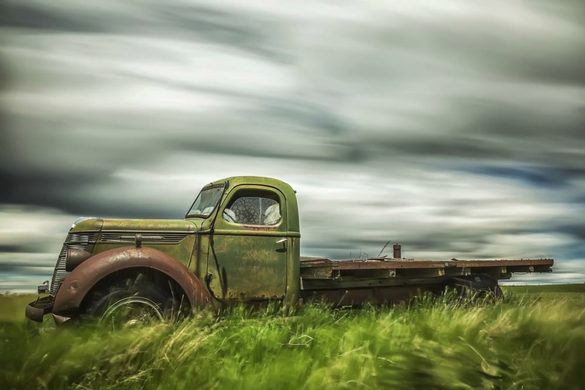 Long exposure of clouds drifting by over an abandoned truck Saskatchewan Canada Canvas Art - Robert Postma Design Pics (19 x 12)