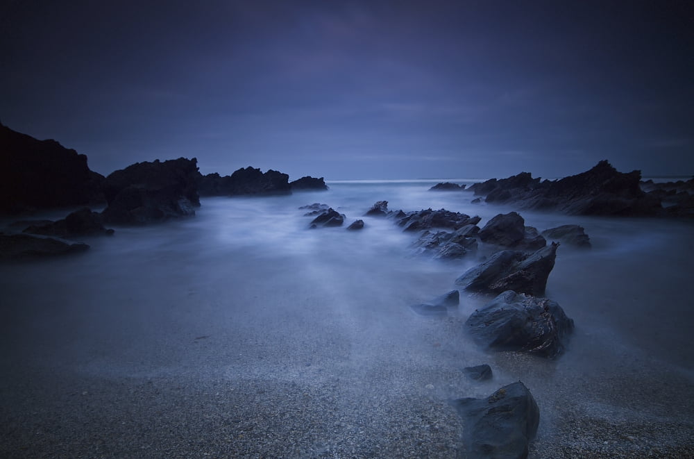 Long exposure of rocks on the beach at nightNewquay cornwall england Canvas Art - James Ingham Design Pics (38 x 24)