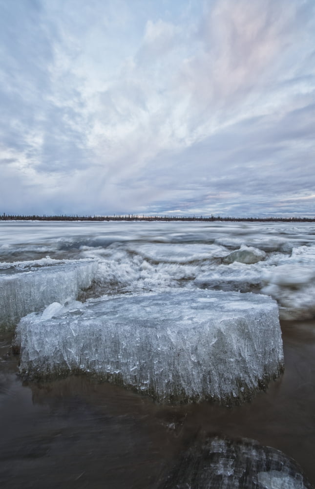 Long exposure of the ice flowing down the Porcupine River after it broke up Old crow Yukon Canada Canvas Art - Robert Postma Design Pics (12 x 19)