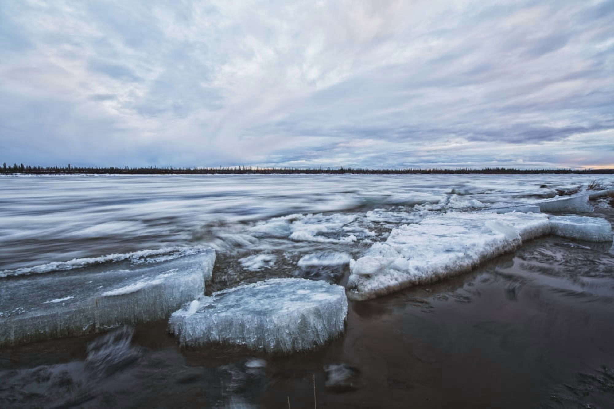 Long exposure of the ice flowing down the Porcupine River after it broke up Old crow Yukon Canada Canvas Art - Robert Postma Design Pics (19 x 12)