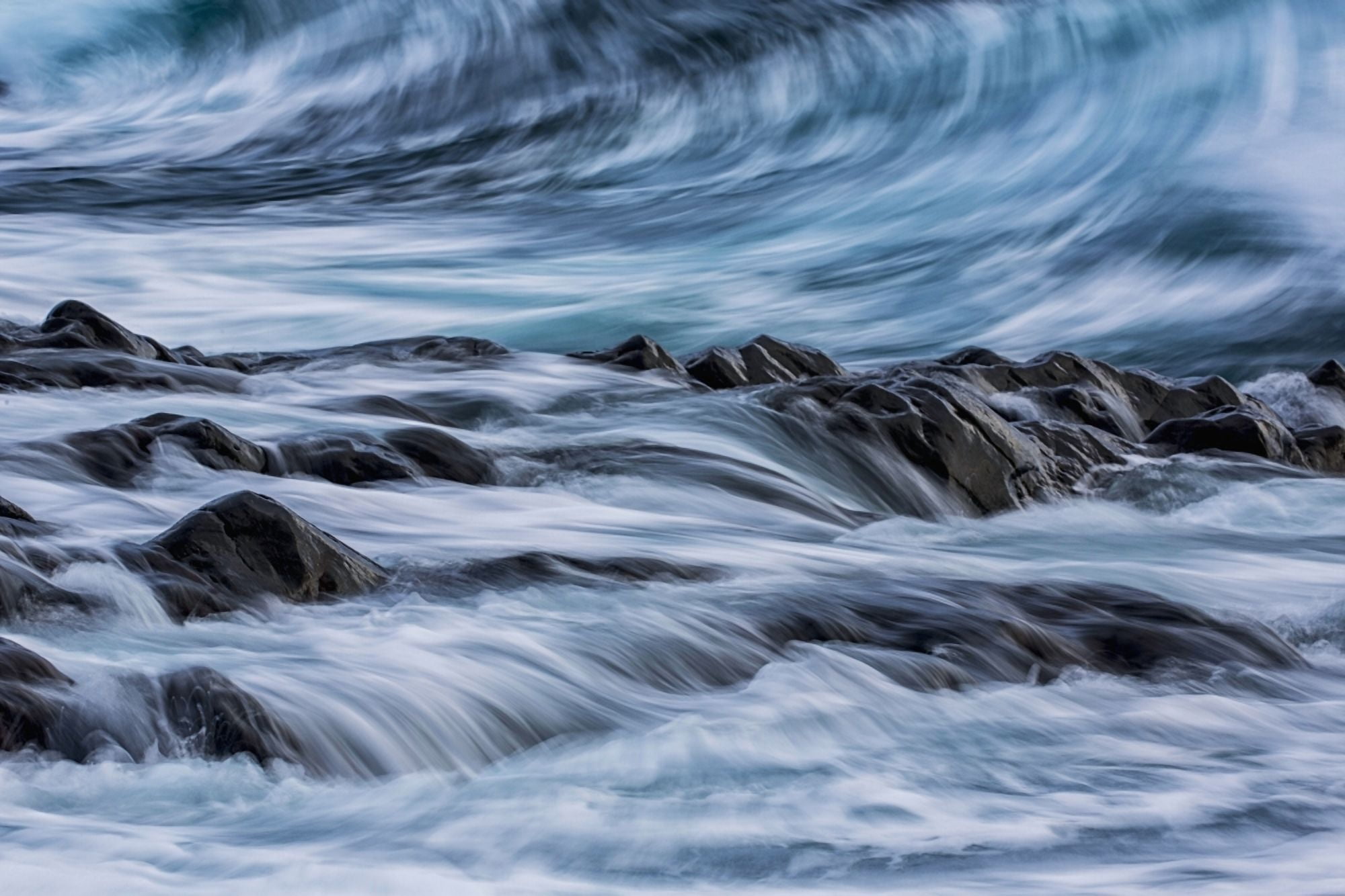 Long exposure of waves striking the coastline and flowing over rocks Iceland Canvas Art - Robert Postma Design Pics (38 x 24)