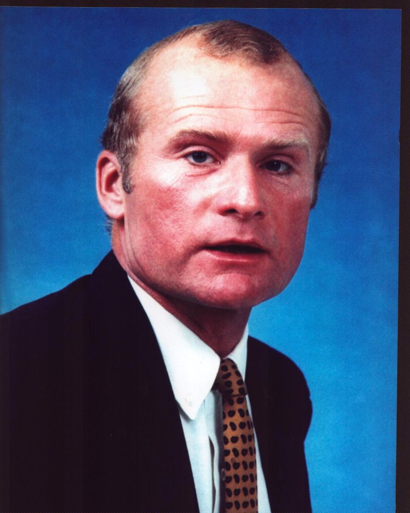 Louis Edmonds In Suit With Blue Background Photo Print (8 x 10) Item