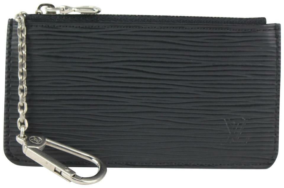 ✨NEW ARRIVAL✨ Louis Vuitton Black Epi Vertical Trunk Pochette $1,900.00  Date Code: NZ3129 Material: Epi leather. Colour: Black. Hardware:…