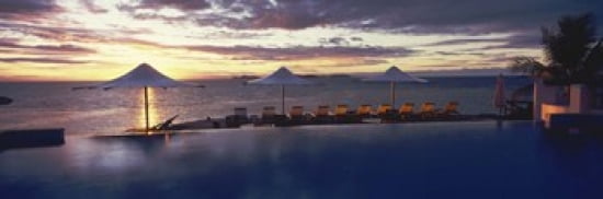 Lounge chairs and patio umbrellas at a tourist resort Matamanoa Island Resort Mamanuca Islands Fiji Canvas Art - Panoramic Images (36 x 12)