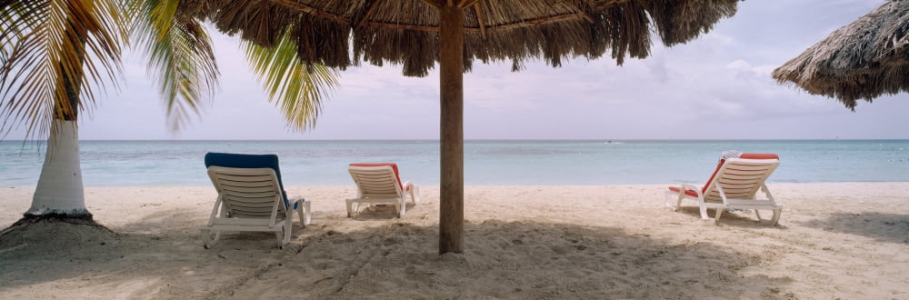 Lounge chairs on 7-Mile Beach Negril Jamaica Canvas Art - Panoramic Images (36 x 12)