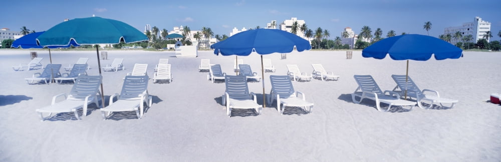 Lounge chairs on the beach South Beach Miami Miami-Dade County Florida USA Canvas Art - Panoramic Images (36 x 12)