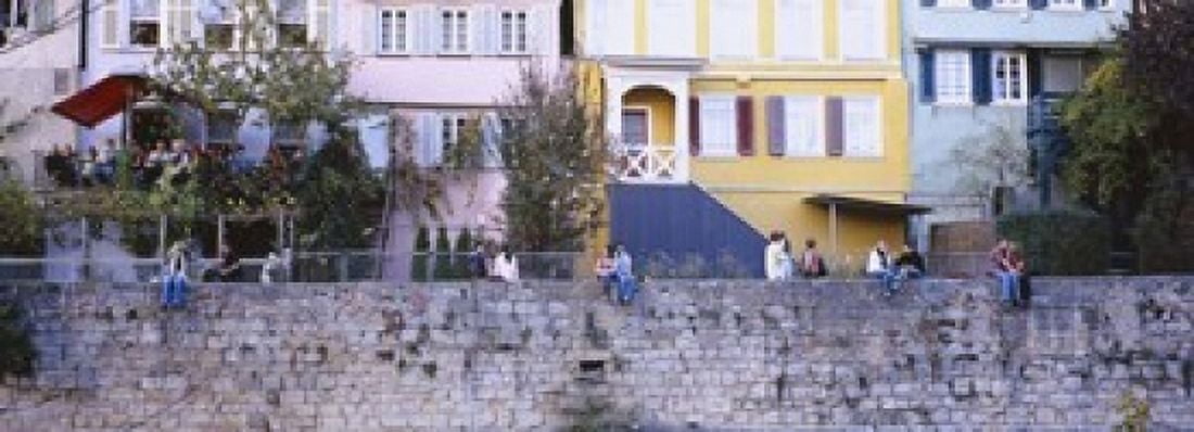 Low Angle View Of A Group Of People Sitting On A Wall Tubingen Baden-Wurttemberg Germany Canvas Art - Panoramic Images (18 x 7)