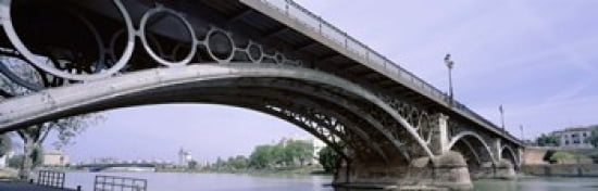Low Angle View Of Isabel II Bridge Over Guadalquivir River Seville Spain Canvas Art - Panoramic Images (36 x 12)