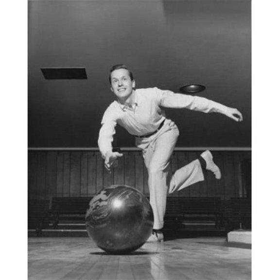 Low Angle View of Young Adult Man Bowling Poster Print - 18 x 24 in.