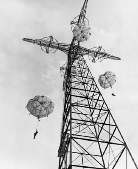 Low angle view of army soldiers parachuting from a tower at a training center Fort Benning South Georgia USA 24 September 1949 Canvas Art - (18 x 24)