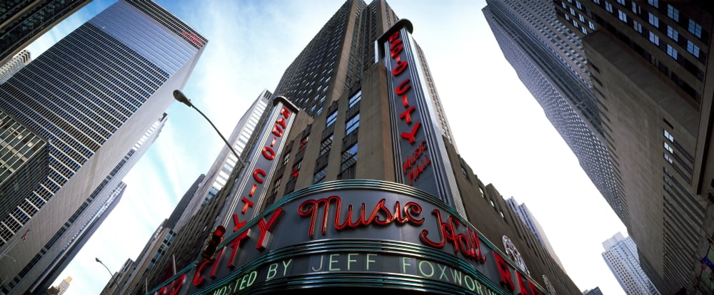 Low angle view of buildings Radio City Music Hall Rockefeller Center Manhattan New York City New York State USA Canvas Art - Panoramic Images (13 x 30)