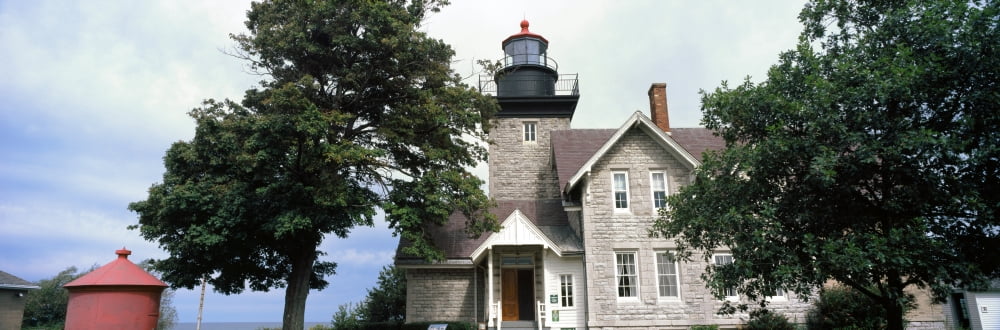 Low angle view of a lighthouse Thirty Mile Point Light Golden Hill State Park Barker Niagara County New York State USA Canvas Art - Panoramic Images (12 x 36)