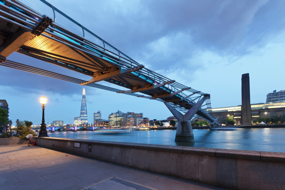 Low angle view of Millennium Bridge Thames River Southwark London England Canvas Art - Panoramic Images (36 x 12)