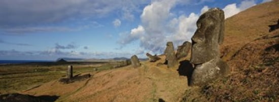 Low angle view of Moai statues Tahai Archaeological Site Rano Raraku Easter Island Chile Canvas Art - Panoramic Images (36 x 13)