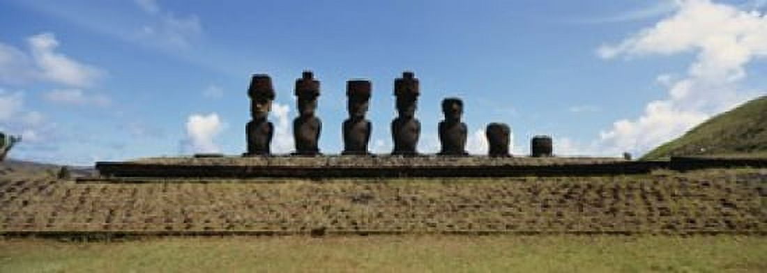 Low angle view of Moai statues in a row Tahai Archaeological Site Rano Raraku Easter Island Chile Canvas Art - Panoramic Images (18 x 7)