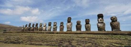 Low angle view of Moai statues in a row Tahai Archaeological Site Rano Raraku Easter Island Chile Canvas Art - Panoramic Images (36 x 13)
