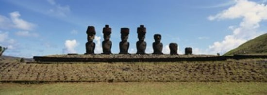 Low angle view of Moai statues in a row Tahai Archaeological Site Rano Raraku Easter Island Chile Canvas Art - Panoramic Images (36 x 13)