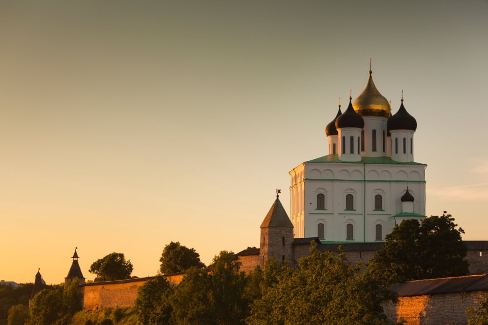 Low angle view of Pskov Kremlin from the Velikaya River at sunset Pskov Pskovskaya Oblast Russia Canvas Art - Panoramic Images (36 x 12)