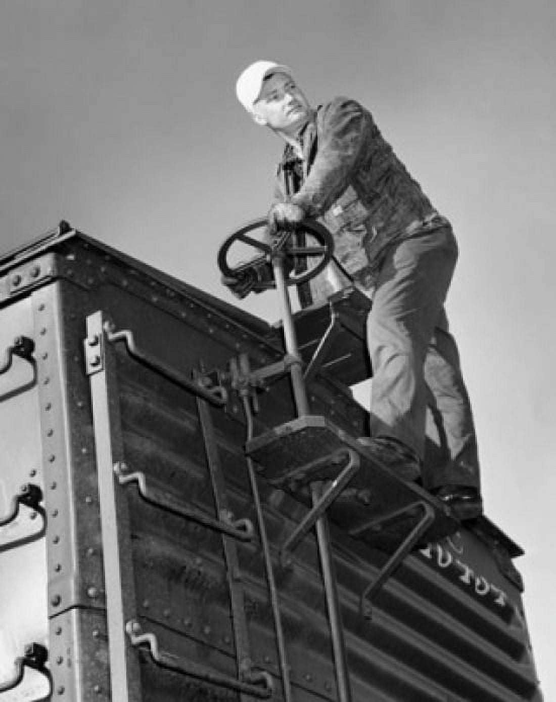 Low angle view of a brakeman standing on a freight car Canvas Art - (18 x 24)