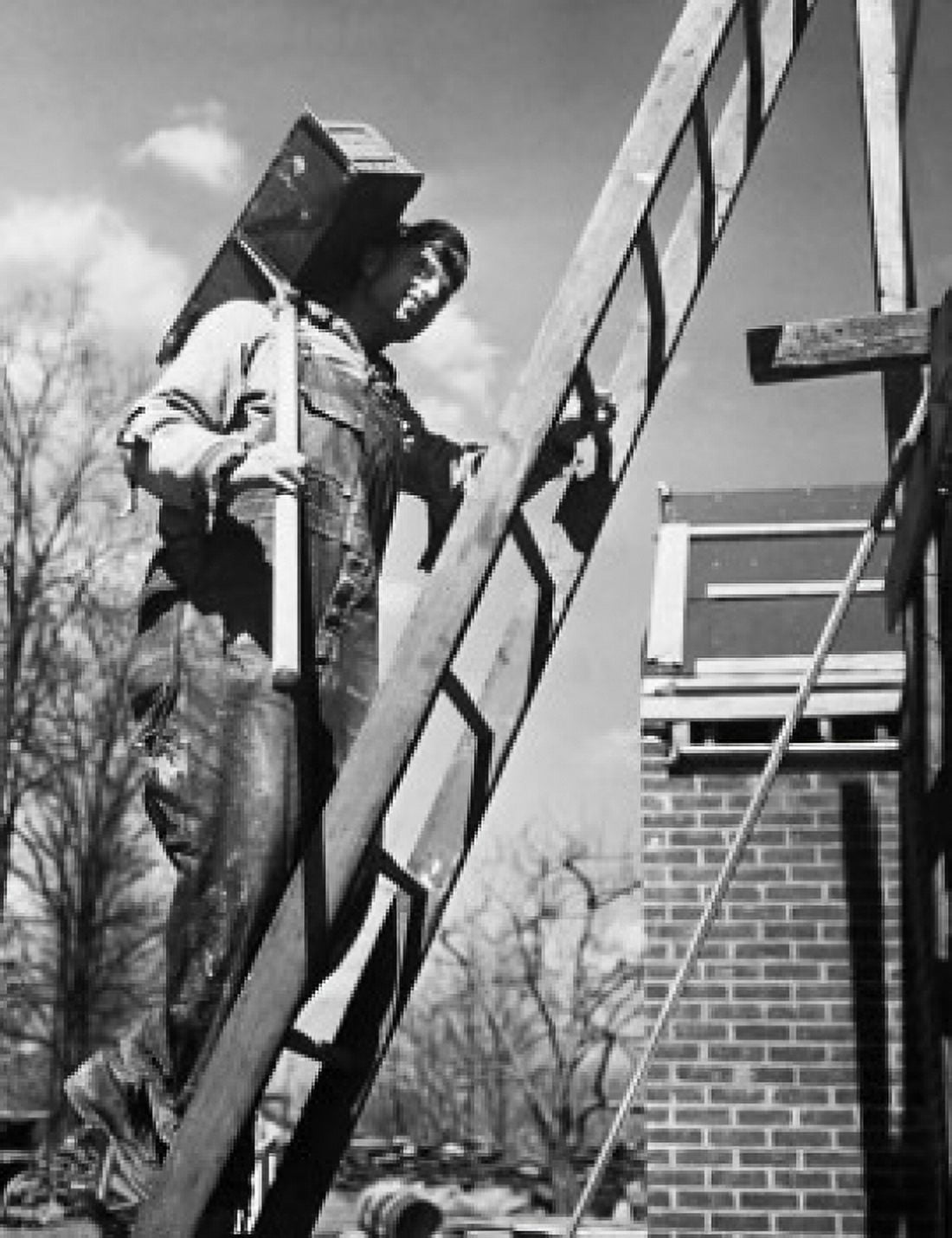 Low angle view of a construction worker carrying bricks on his shoulder Canvas Art - (18 x 24)