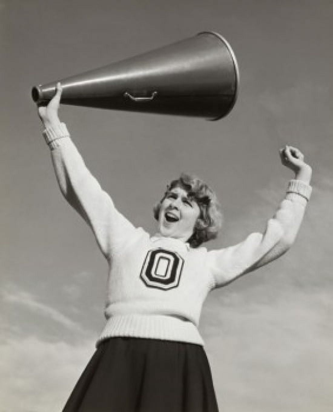Low angle view of a female cheerleader holding a megaphone and shouting Canvas Art - (24 x 36)