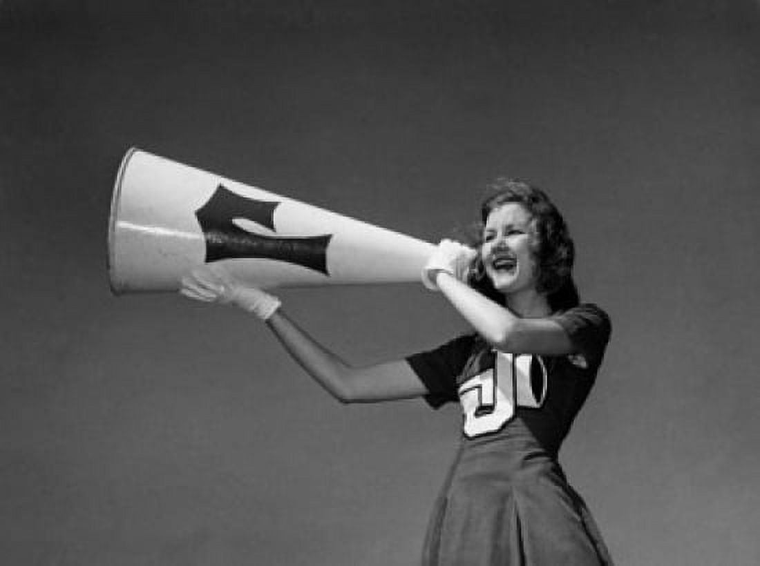 Low angle view of a female cheerleader shouting into a megaphone Canvas Art - (18 x 24)