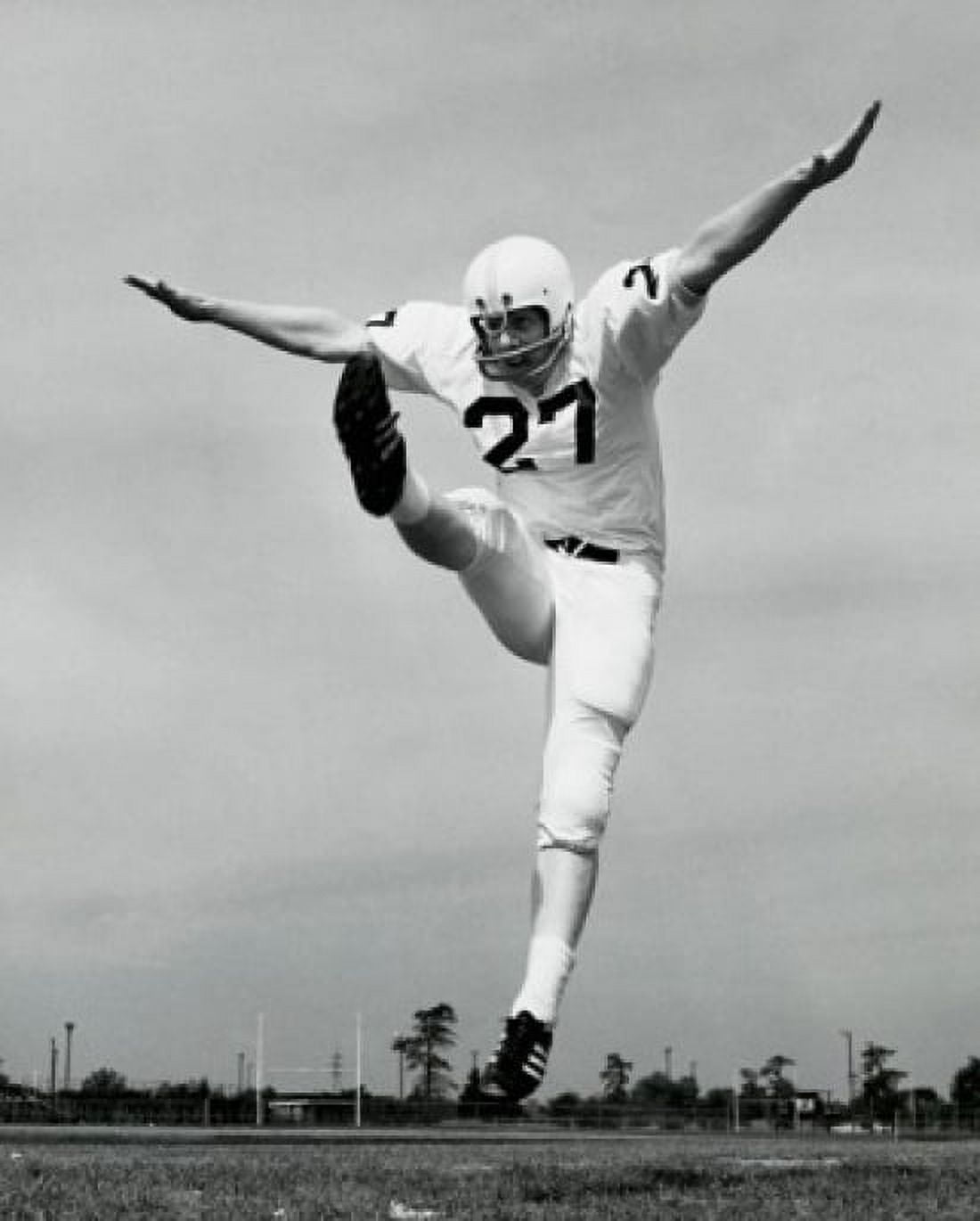 Low angle view of a football player kicking Canvas Art - (24 x 36)