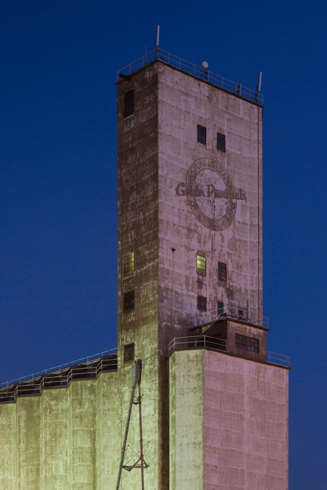 Low angle view of a grain elevator at dusk Dodge City Ford County Kansas USA Canvas Art - Panoramic Images (24 x 36)