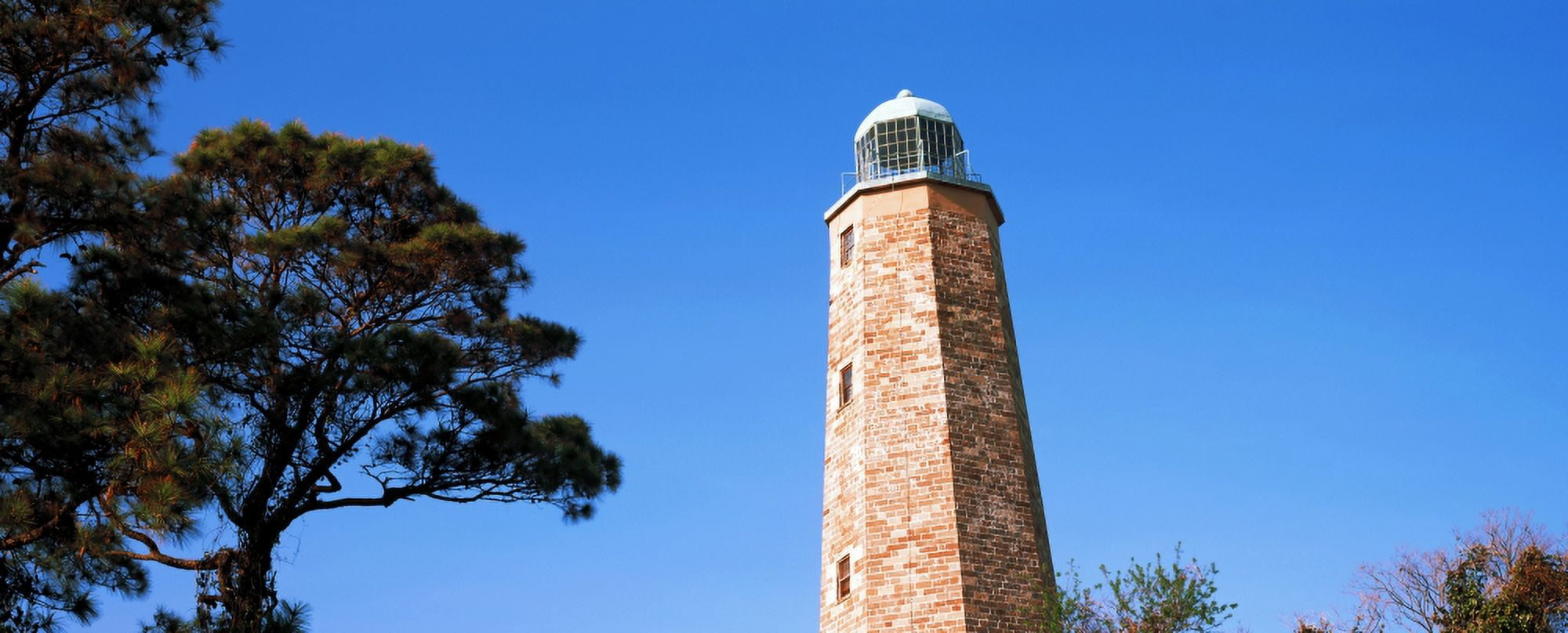 Low angle view of a lighthouse Cape Henry Lighthouse Cape Henry Virginia Beach Virginia USA Canvas Art - Panoramic Images (27 x 9)