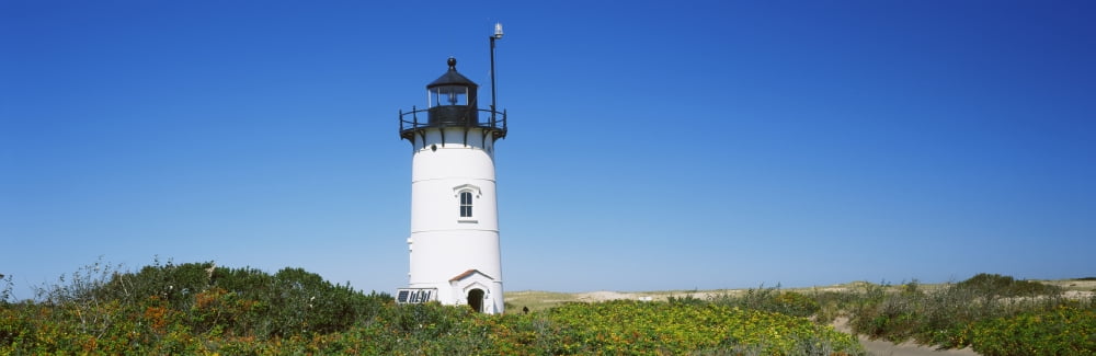 Low angle view of a lighthouse Race Point Light Provincetown Cape Cod Barnstable County Massachusetts USA Canvas Art - Panoramic Images (12 x 36)