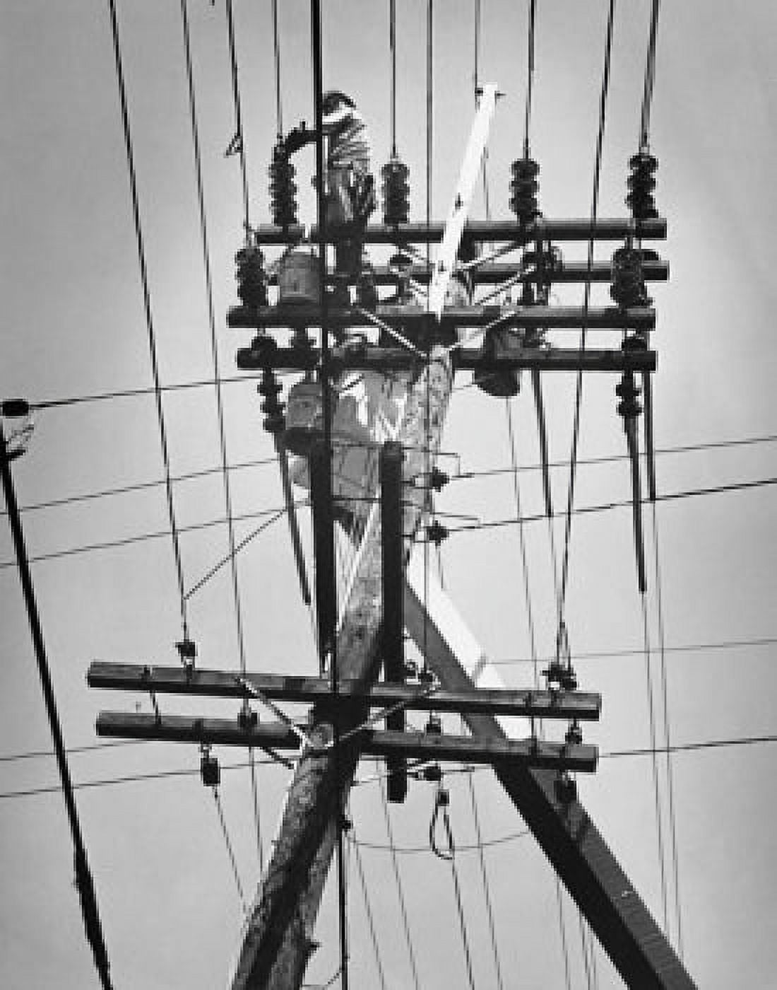 Low angle view of a lineman on the telephone pole Canvas Art - (18 x 24)