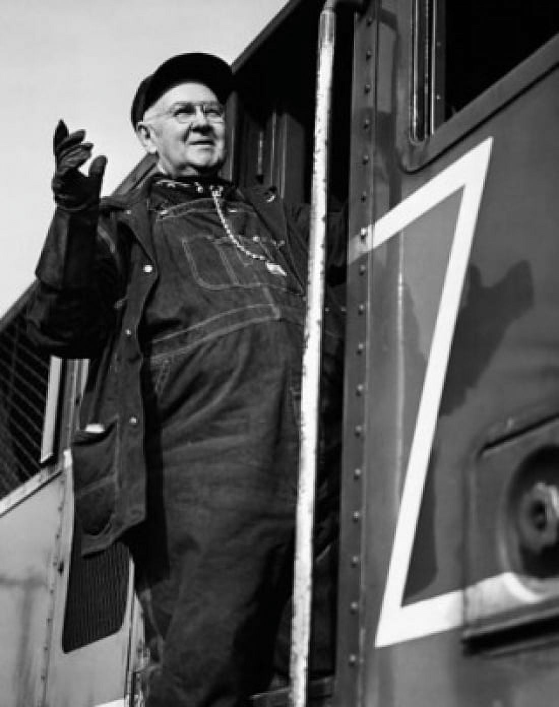 Low angle view of a locomotive engineer standing on a train Canvas Art - (24 x 36)
