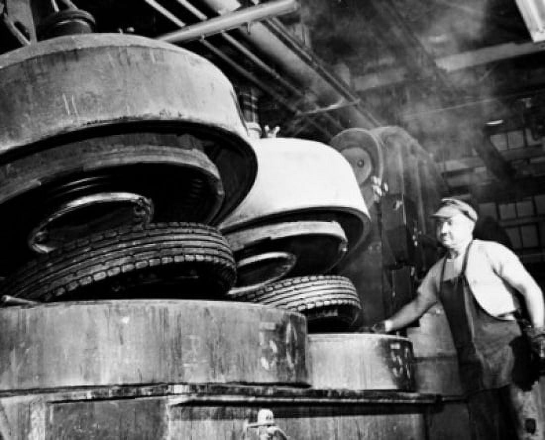 Low angle view of a male worker working in a tire factory Canvas Art -  (18 x 24)