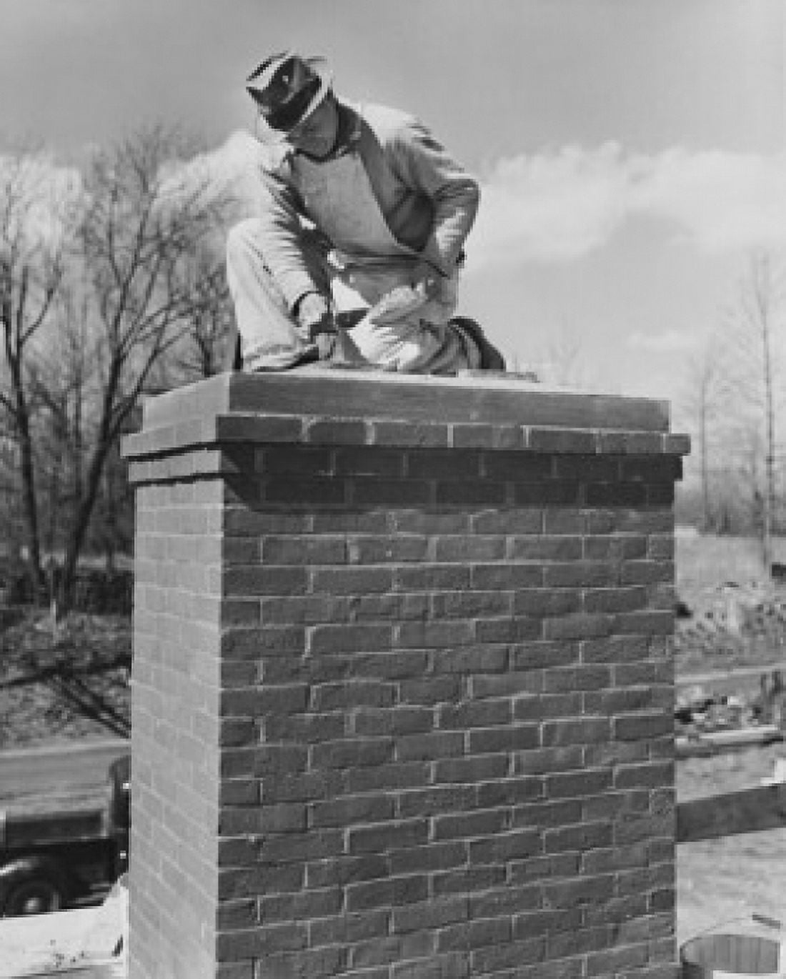 Low angle view of a man repairing a chimney Canvas Art - (18 x 24)