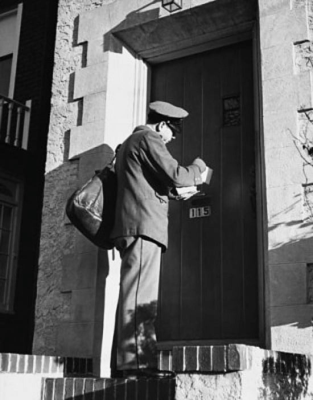 Low angle view of a postman delivering mail Canvas Art - (24 x 36)