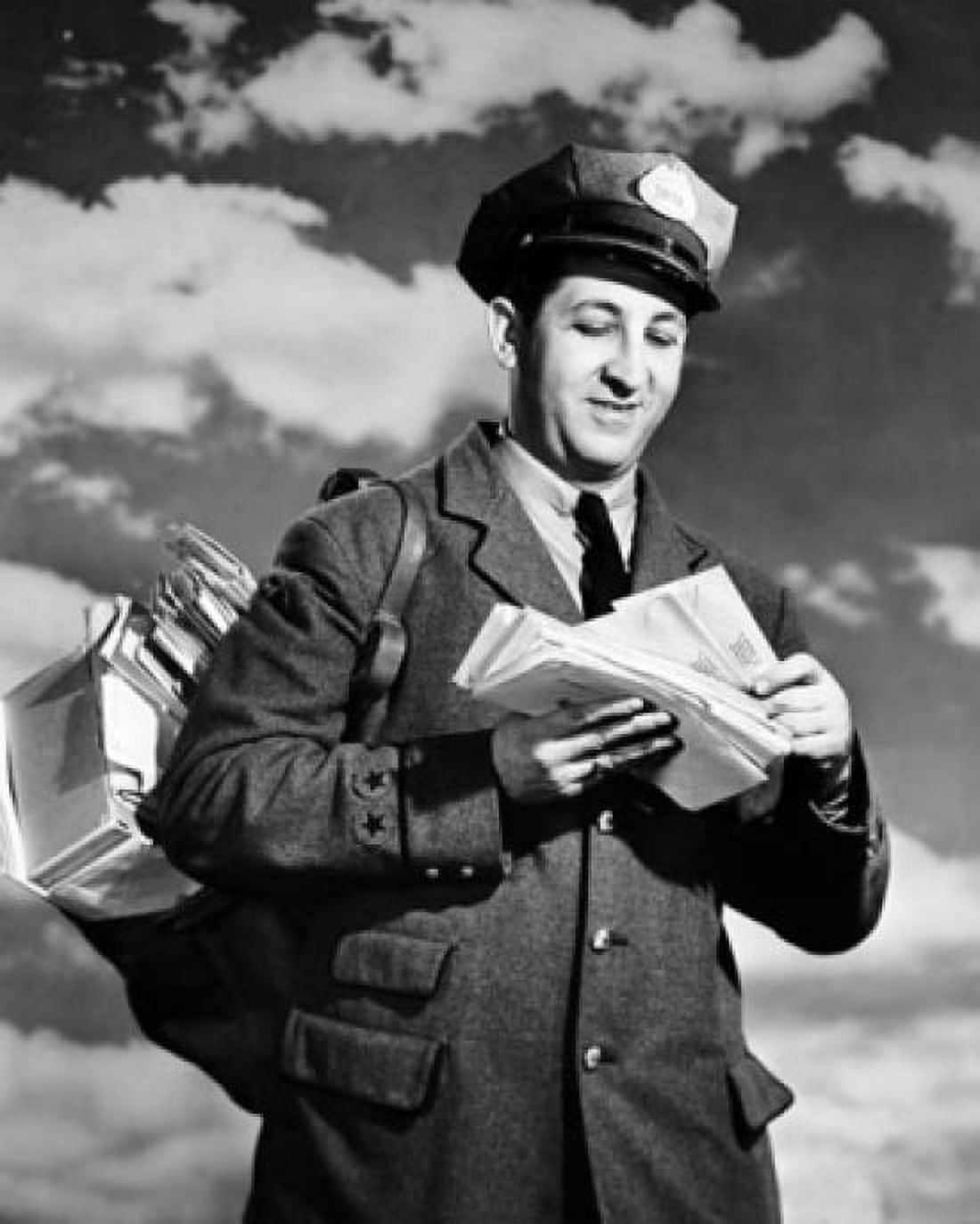 Low angle view of a postman holding mail Canvas Art - (18 x 24)