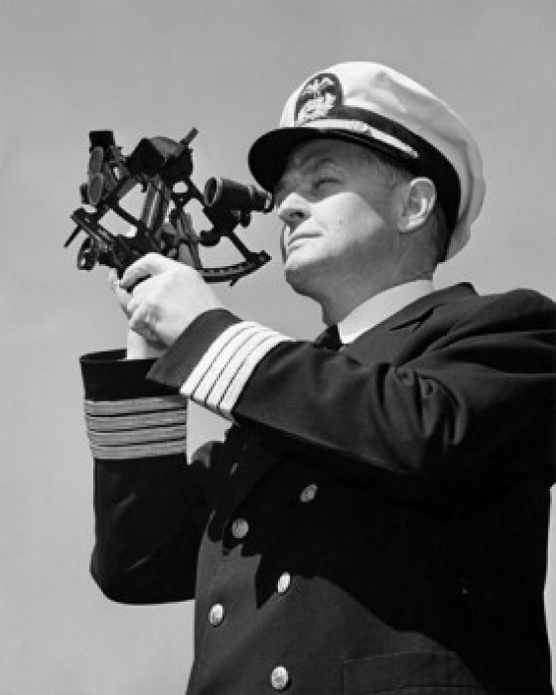 Low angle view of a ship captain looking through a sextant Canvas Art - (18 x 24)