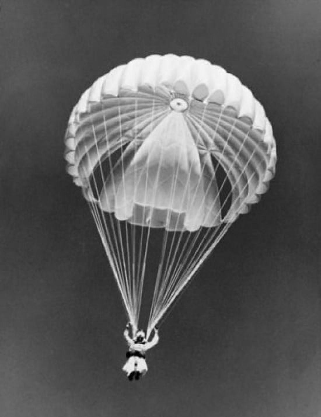 Low angle view of a smoke jumper parachuting to battle forest fire Canvas Art - (24 x 36)