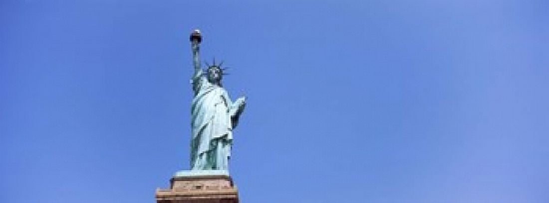 Low angle view of a statue Statue Of Liberty Liberty Island New York City New York State USA Canvas Art - Panoramic Images (18 x 7)