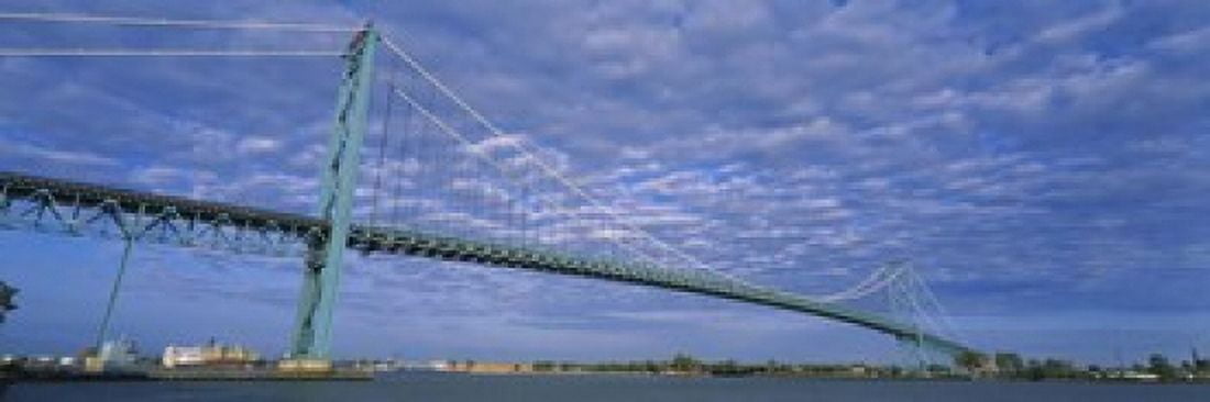 Low angle view of a suspension bridge over the river Ambassador Bridge Detroit River Detroit Michigan USA Canvas Art - Panoramic Images (18 x 6)
