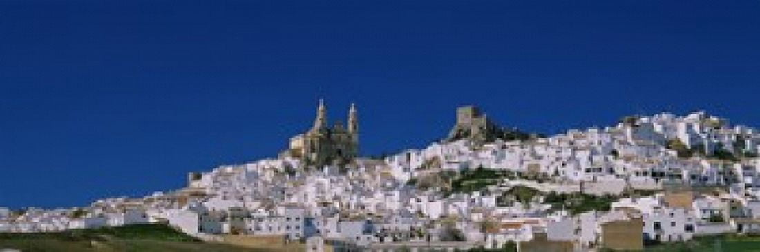 Low angle view of a town Olvera One of the White Villages of Andalucia Cadiz Province Spain Canvas Art - Panoramic Images (18 x 6)